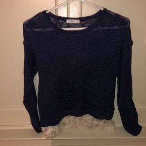 Navy sweater with white mesh design at bottom